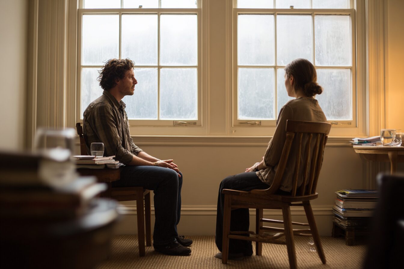 A therapy session moment contrasting the sex-addiction label with schema therapy's focus on the wound beneath the behavior.
